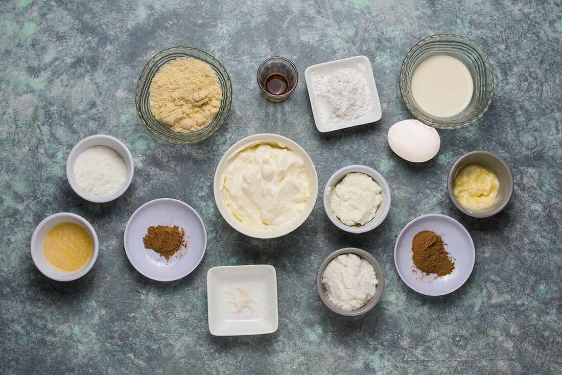 Overhead flat-lay of measured recipe ingredients in bowls